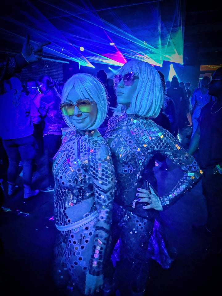 Luxury reflective festival outfit for EDC and stage events.